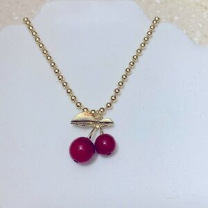Gold Necklace with Cherry Pendant.